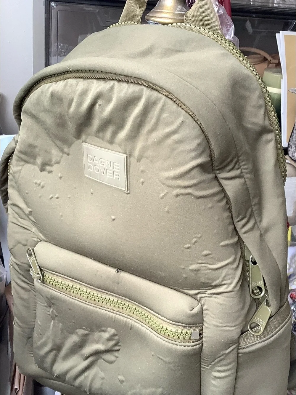 Dagne Dover Olive Backpack with Front Zip Pocket (puckering throughout)